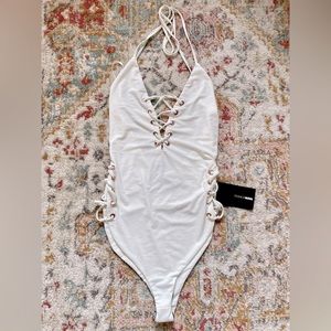 Cheeky lace-up one piece in white- size S
